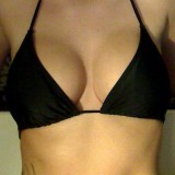 Korina Bliss shows off her big tits in a tiny black bikini on webcam